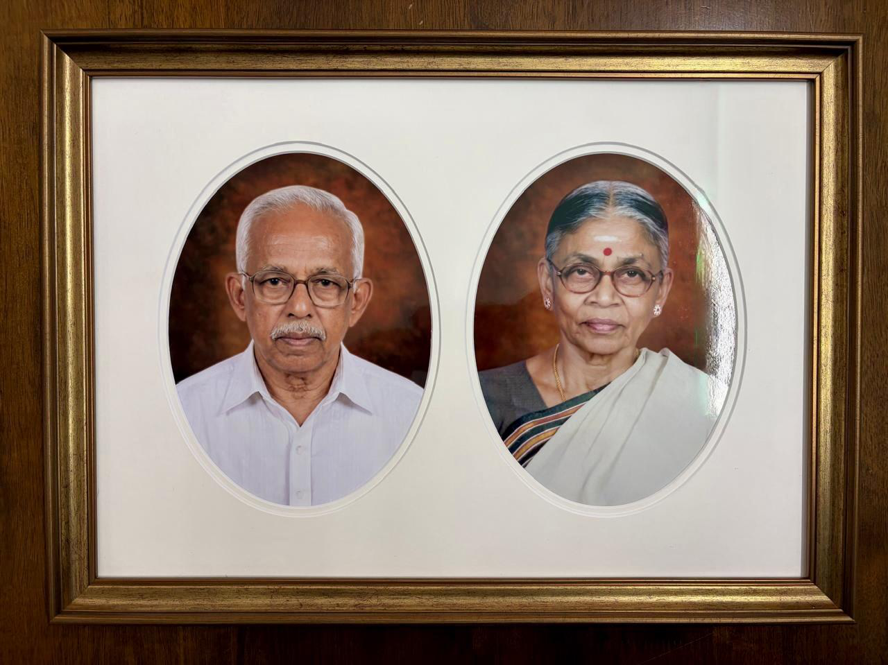 Framed portraits of V. Thulasiraman and Ramani Thulasiraman